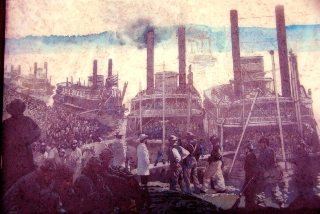 A painting of people standing around in front of large industrial buildings.